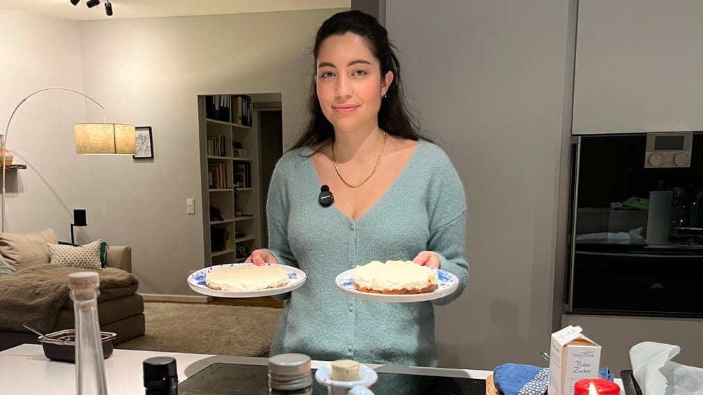 Isabella Cordesmeyer with two cakes in her kitchen