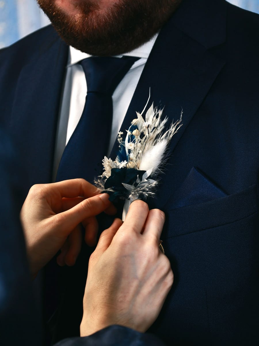 Finishing touches on a navy suit