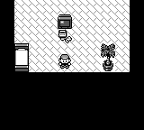Pokémon Red frame showing the player character in Professor Oak's lab among several people and objects