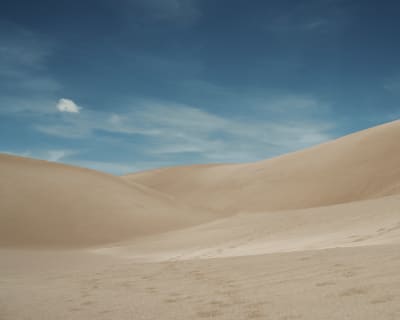 A look at sand dunes against the blue Colorado sky