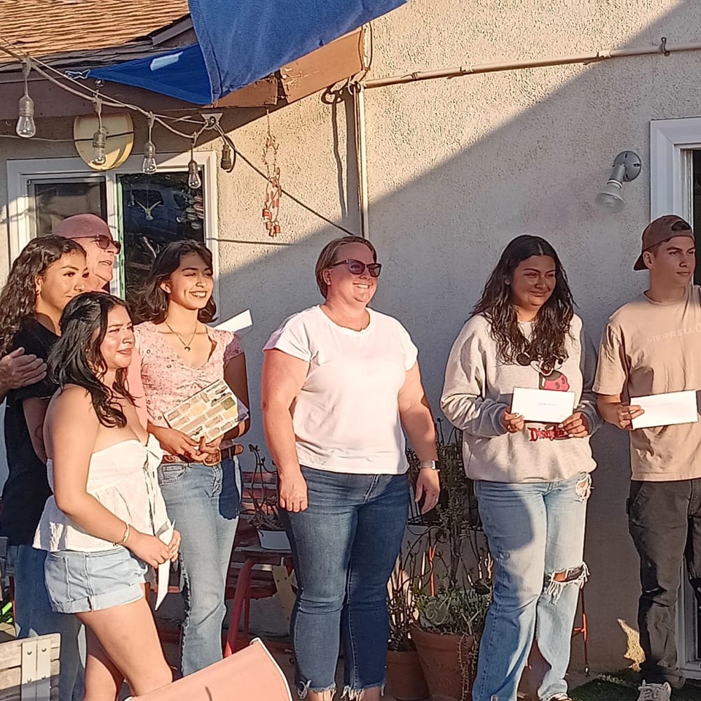 Interact students with service award certificates