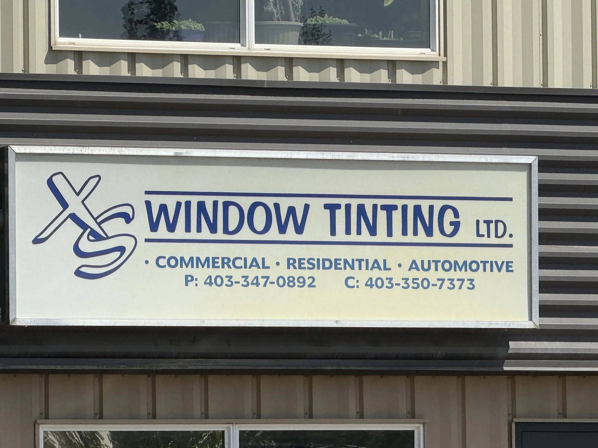 XS Window Tinting logo — detailing & protection in Red Deer, Alberta