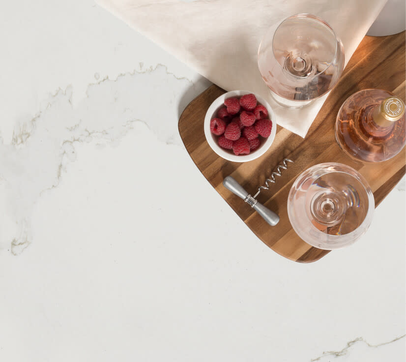 Coffee and raspberries on counter