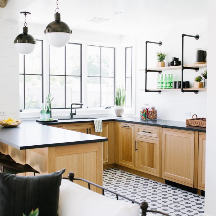 Absolute Black Granite honed 2cm slab on counter with Enchante 8x8 porcelain tile on floor