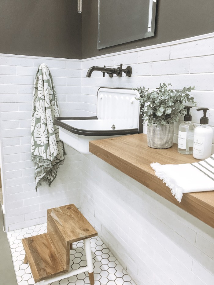 Walls: Uptown 2.5x9.5 ceramic decorative tile in White | Floor: Le Cafe 2x2 porcelain hexagon tile in matte White