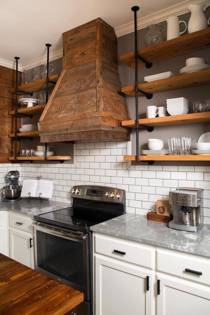 Subway tile wall with open shelving and steel pipe supports