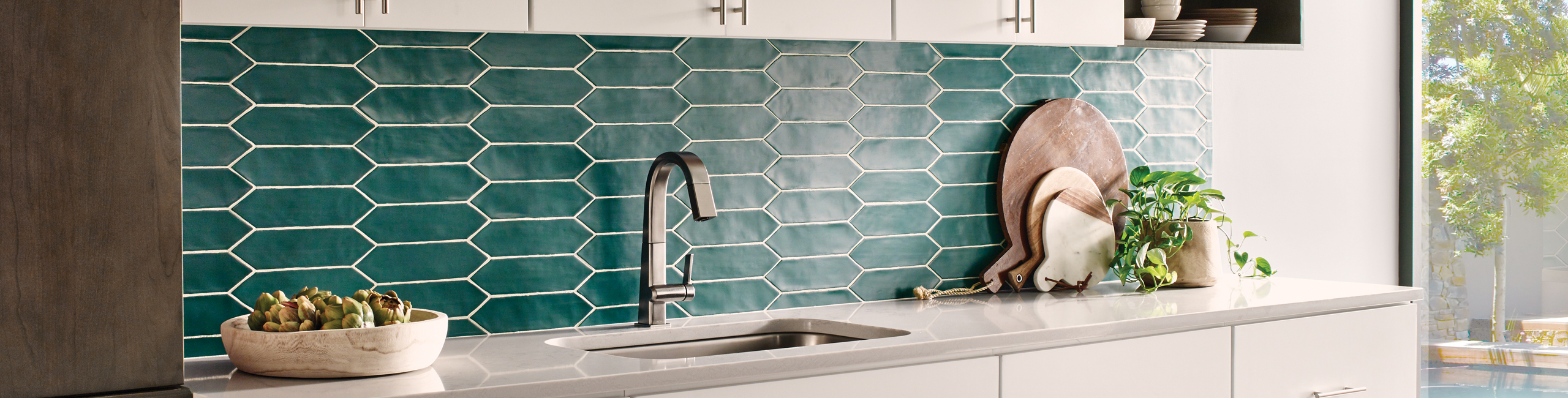 Bedrosians Reine picket style ceramic tile backsplash in Teal