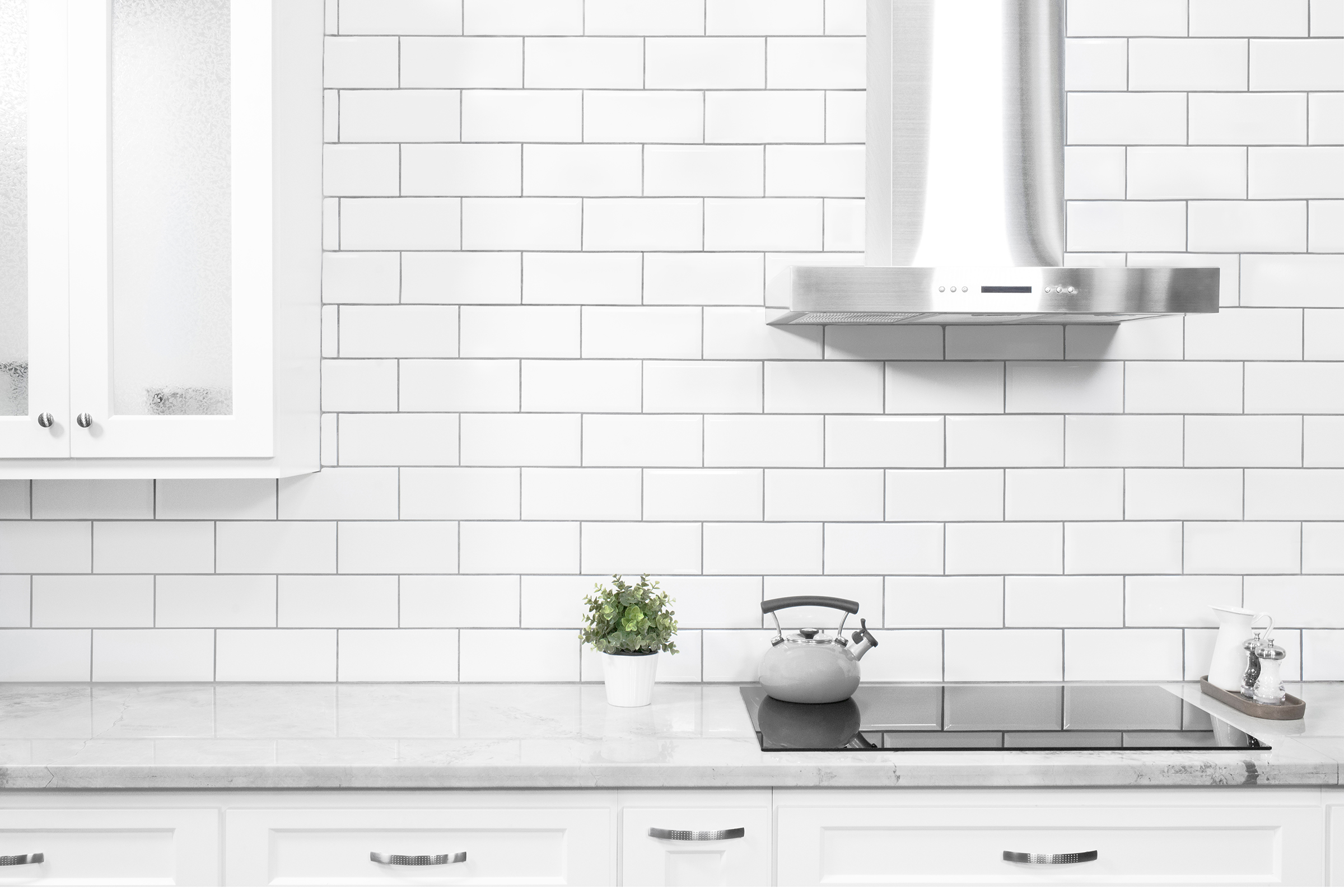 kitchen that has subway tile wall