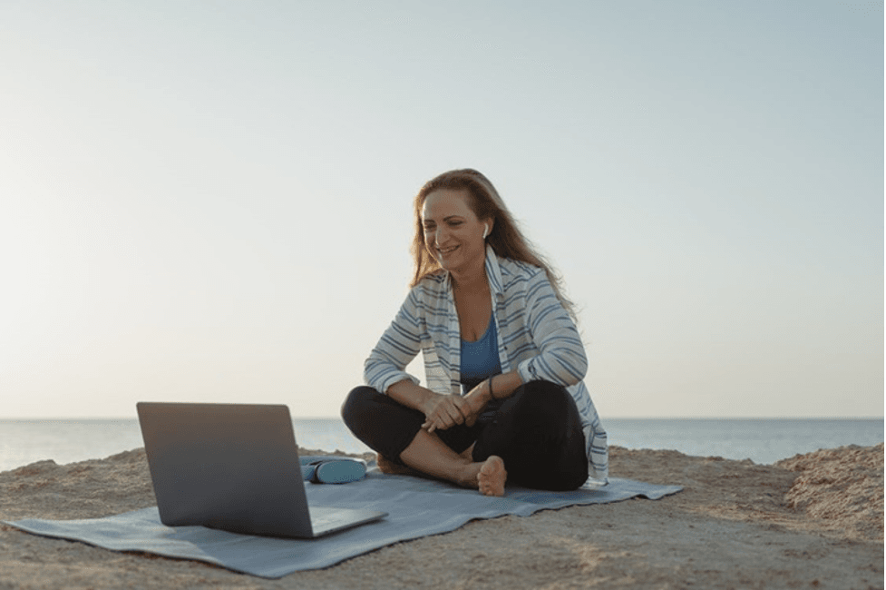The Woman Makes the Virtual Meeting using the Laptop