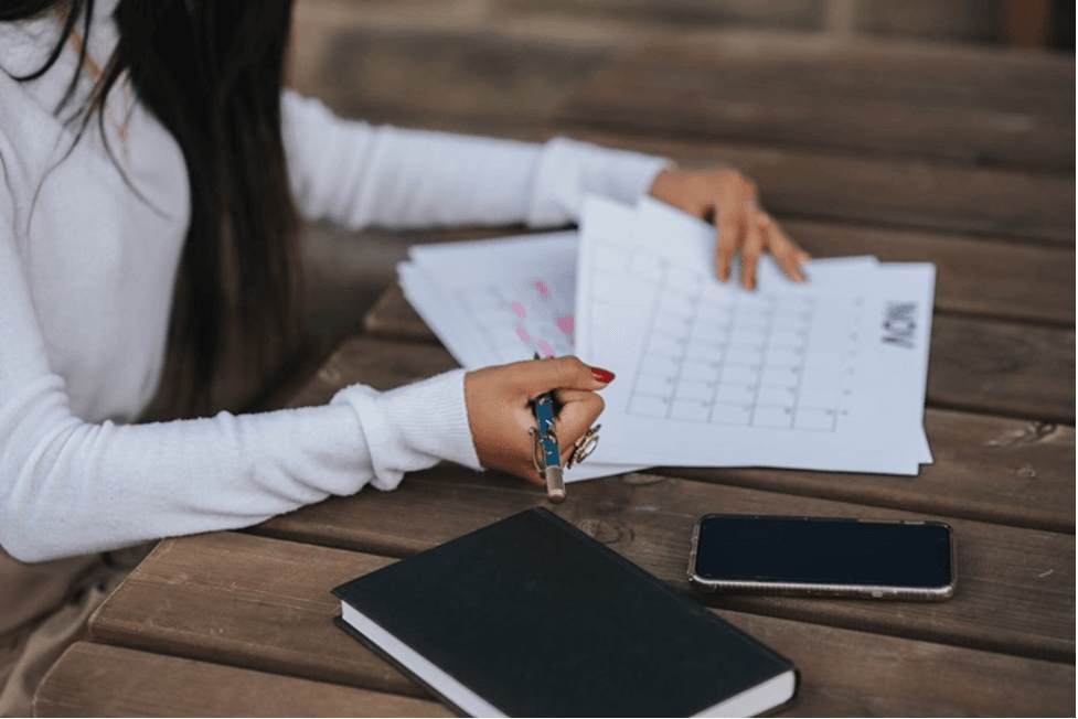 The Woman is Scheduling and Planning the Itinerary