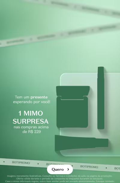 Imagem de um produto promocional do Grupo Boticário. O produto é apresentado em um fundo verde. O texto informa que é "1 MIMO SURPRESA" com compras acima de R$299,00. Há um botão "Quero" para o usuário interagir.