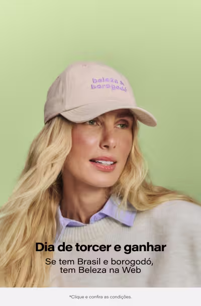 Mulher loira usando boné branco com a frase "Belezas borogodó" em letras roxas, olhando diretamente para a câmera com expressão séria. Texto abaixo da imagem: "Dia de torcer e ganhar. Se tem Brasil e borogodó, tem Beleza na Web".
