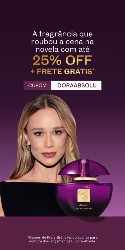 Uma mulher loira em um fundo roxo escuro. A fragrância Eudora Absolu que a Dora usou novela pode ser sua!