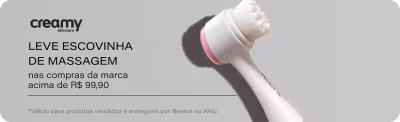 Creamy Skincare oferece escovinha de massagem de cortesia nas compras acima de R$9990 da marca. Imagem exibe escovinha branca com cabo rosa e botão de ação. Link de garantia disponível. Válido para produtos vendidos por Evas Perfumaria e entregue por Beleza na Web.