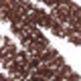 Lápis de olho da marca M·A·C, com embalagem marrom e preta, com o nome "Kajal Excess" impresso. O lápis possui uma ponta afilada e uma textura metálica.