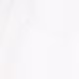 Embalagem composta por um pote plástico transparente com tampa preta. O pote contém um pó branco solto. A tampa preta possui o logotipo e o nome do produto "Fixing Powder" impresso em letras brancas.