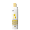 Shampoo nutritivo em frasco plástico branco de 300ml. Rótulo com texto "Nutricao N" em letras amarelas e coroa estilizada acima. Descrição dos ingredientes como avelã, abacate e pracaxi. Indica ser vegano, livre de crueldade e liberado. Detalha pH 4,5.