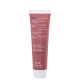 Tubo de creme esfoliante facial da marca Korres, com rótulo em inglês e grego, indicando ingredientes naturais e propriedades de suavização e iluminação da pele.