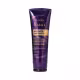 Embalagem plástica tubular de cor roxa escura com detalhes em dourado. Logotipo da marca Eudora e linha Siàge visíveis em dourado. Ao fundo, em roxo mais claro, a letra S de Siàge.