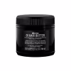 Pote preto de 250 ml da linha Davines Oi Hair Butter, um produto para tratamento capilar com rótulo destacando seus benefícios de beleza absoluta para todos os tipos de cabelo.