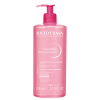 Frasco de gel de limpeza facial Sensibio da Bioderma, com 525g, embalagem rosa com bomba doseadora e rótulo com nome da marca e produto.