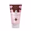 Creme esfoliante Deleite Chocolatudo da linha Cuide-se Bem da marca O Boticário. Embalagem plástica tubular de cor rosa claro com detalhes em marrom. Rótulo com ilustração de uma vaca usando coroa e segurando uma barra de chocolate.