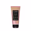 A imagem mostra a Loção iluminadora hidratante da linha Instance Baunilha Glow da marca Eudora. Embalagem plástica de 180ml na cor rosa perolada com detalhes dourados brilhantes e tampa preta.