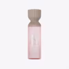 Frasco de perfume Lattafa Teriac com design ondulado em tons de bege e rosa, contendo texto em árabe e inglês indicando "Perfume Mist".