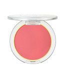 A imagem mostra um blush compacto de cor rosa em uma embalagem plástica transparente. O blush tem um acabamento fosco e está disposto em um estojo redondo. Em volta do pó compacto rosa, há um aro amarelo que realça a cor do produto.