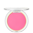 A imagem mostra um blush compacto de cor rosa pink em uma embalagem plástica transparente. O blush tem um acabamento fosco e está disposto em um estojo redondo. Em volta do pó compacto rosa, há um aro amarelo que realça a cor do produto.