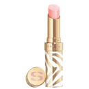 Bálsamo labial em embalagem dourada com detalhes brancos e marrons em padrão zebrado. A cor do hidratante é rosa claro. O rótulo "Sisley Paris" está visível na embalagem dourada. Há também um pequeno espelho compacto dourado com o logotipo "S".