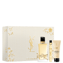 A imagem mostra o conjunto de produtos da linha Libre de Yves Saint Laurent. Mostra o frasco do perfume Libre de 90ml, a versão em miniatura e uma loção corporal de 50ml. Ao lado mostra a caixa especial, branca com detalhes texturizados dourados.