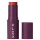 A imagem mostra o Blush Stick da marca Océane em embalagem cilíndrica de plástico roxo com o nome do produto em letras brancas. A embalagem está aberta mostrando um pouco da cor do blush em tom de vermelho e a tampa está ao lado.