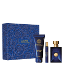 A imagem mostra um frasco de perfume retangular azul escuro com detalhes dourados, um frasco menor de amostra do mesmo perfume, e um tubo de gel de banho. Os itens estão embalados em uma caixa decorativa azul escura com um padrão floral estampado.