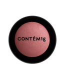 A imagem mostra uma embalagem fechada de blush. A embalagem é preta com parte transparente e o logo da marca em preto.