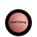 A imagem mostra uma embalagem fechada de blush. A embalagem é preta com parte transparente e o logo da marca em preto.