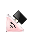 O frasco possui um formato triangular com uma tampa preta. A embalagem é predominantemente rosa, com o nome "PRADA" em preto destacado no centro. O rótulo também exibe o texto "Virtual Flower" em letras menores.