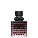 Frasco de perfume Valentino com design facetado em tons de rosa e preto, com rótulo destacado em letras pretas.