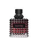 Frasco de perfume Valentino com design geométrico facetado em tons de rosa e preto, com rótulo em destaque exibindo o nome da marca.