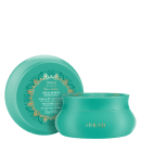 Máscara capilar nutritiva Amend Millenar com óleos árabes, em embalagem redonda verde com detalhes decorativos em laranja, contendo 300g do produto.