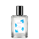 Frasco de perfume Phebo Flor de Maio, com embalagem de vidro transparente e rótulo branco com detalhes em azul, exibindo o nome da marca e a fragrância.