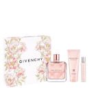 Conjunto Givenchy, incluindo um frasco de perfume Irresistible com embalagem floral, um tubo de creme corporal e um pequeno frasco de óleo, todos em tons de rosa e branco.