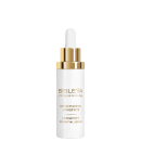 Frasco de vidro branco com conta-gotas dourado, rótulo com nome da marca "Sisley" e texto "L'Integral Anti-Age Sérum Essentiel Longévité" em dourado, produto de cuidados para a pele.