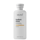 Frasco branco de 300 ml da linha Radiant Gloss da Keune, um shampoo iluminador com extrato de orquídea, com rótulo preto e branco destacando o nome da marca e do produto.
