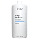 Frasco branco da linha Scalp Sensitive da Keune, contendo condicionador calmante para o couro cabeludo. Rótulo com nome do produto e ingrediente principal, Boswellia Serrata, em destaque.