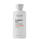 Frasco branco da linha Confident Curl da Keune, um condicionador para realçar cachos, com rótulo destacando o nome do produto e ingrediente principal, extrato de amaranto.