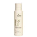 Frasco de shampoo de 300ml da linha Blond Me da Schwarzkopf Professional, com rótulo destacando o nome do produto "Bond Repair Nourishing Shampoo" e informações sobre sua função de fortalecer e hidratar os cabelos.