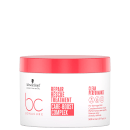 Frasco branco com rótulo vermelho da linha Bonacure da Schwarzkopf Professional, contendo o "Repair Rescue Treatment Care-Boost Complex" para cabelos danificados, com informações sobre o produto em inglês.