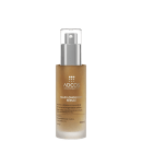 Frasco de vidro transparente com tampa de metal prata contendo um sérum de beleza da marca Adcos. O rótulo exibe o nome "NAD LONGEVITY SÉRUM" em letras brancas sobre fundo dourado.