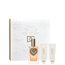Conjunto de produtos de beleza Dolce & Gabbana, composto por um frasco de perfume com design ornamentado, acompanhado de dois tubos de creme em embalagem branca com detalhes dourados.